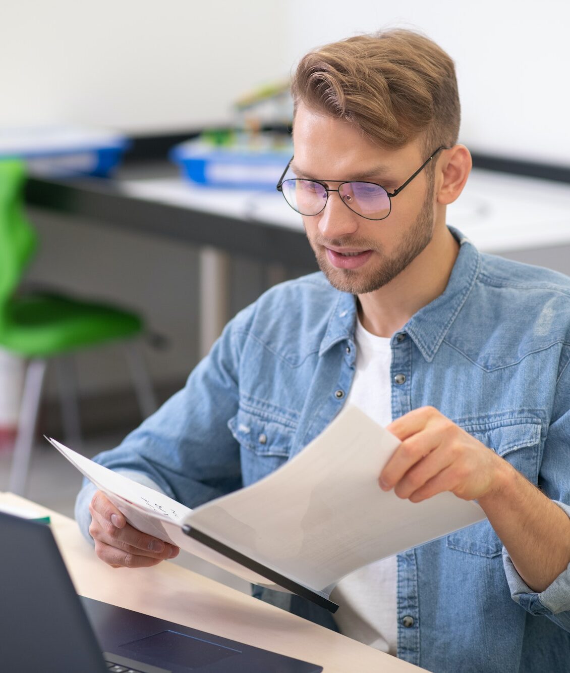 Online Coding School - Image of teacher reading pupils work